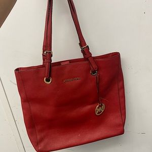 Michael Kors red handbag